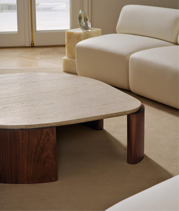 travertine and wood coffee table in a modern living room