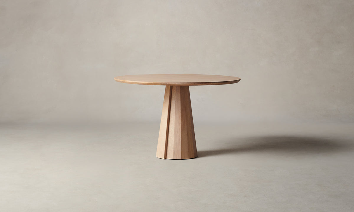 bank round wood dining table in natural oak