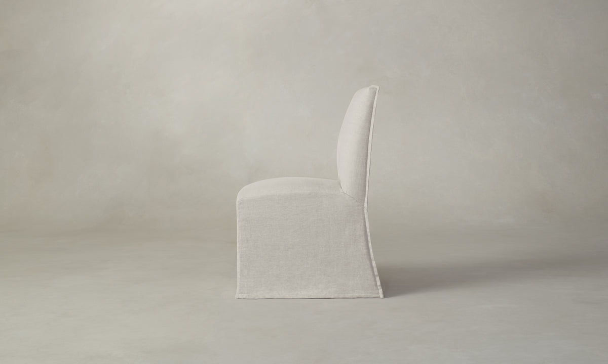 beacon slipcovered dining chair in white linen, side view