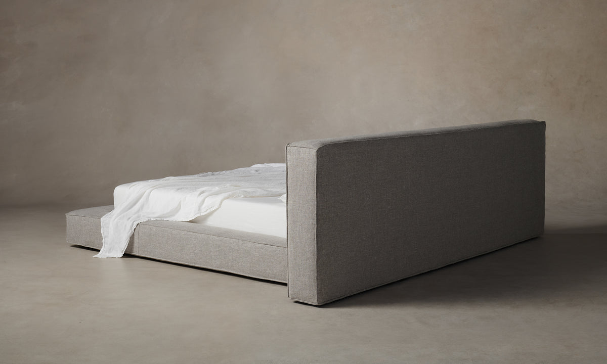 eldridge upholstered bed with cushion bed frame in grey linen - back view