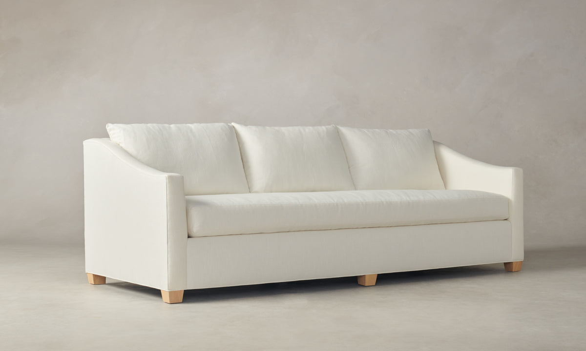 sullivan off-white linen sofa with wooden legs and 3 seats - angle view